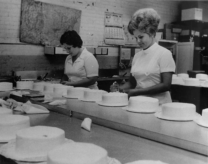 Bakers hand-decorate cakes at the main plant of Hough Bakery, 1973. CPL.