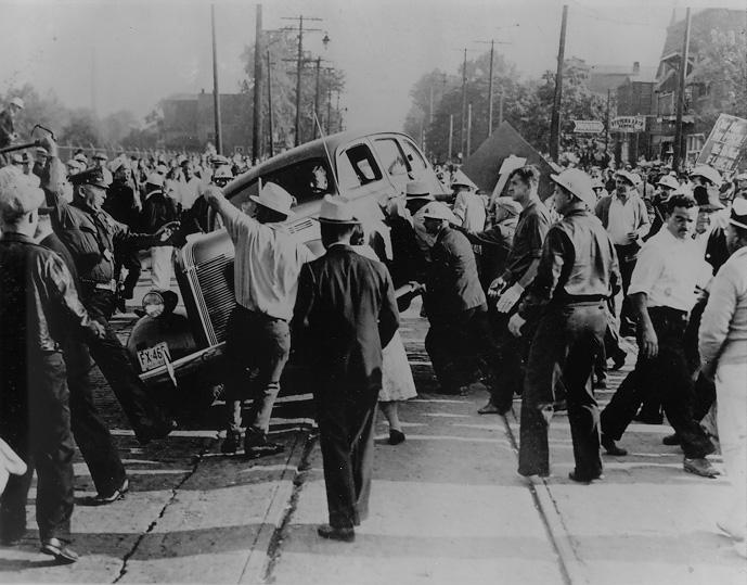 Violence erupts as strikers overturn a vehicle outside the Fisher Body Plant, 1939. Cleveland Press Collection, CSU Archives/Photo by Fred Bottomer.