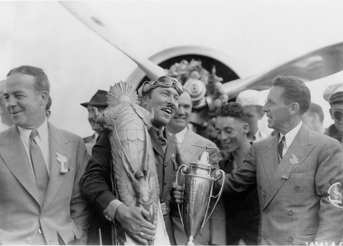 Fred Crawford (right) presents the Thompson Trophy to Roscoe Turner at the National Air Races. WRHS.