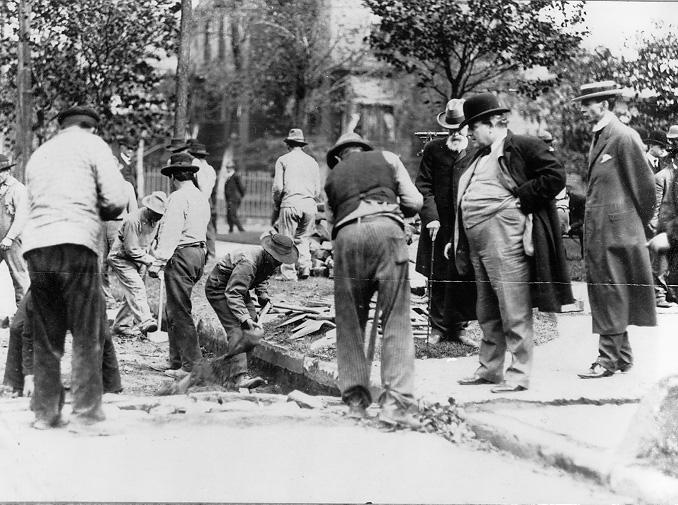 Cleveland Mayor Tom L. Johnson inspects a city street repair crew and its work, ca. 1907. WRHS.