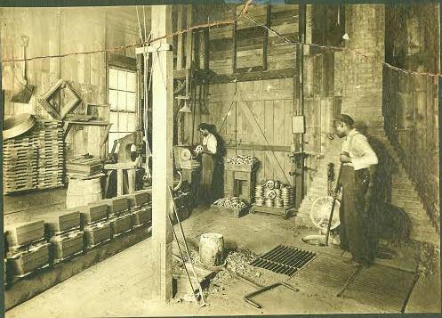 George G. Jones with assistant at Favorite Brass Foundry, 2539 Central Ave.