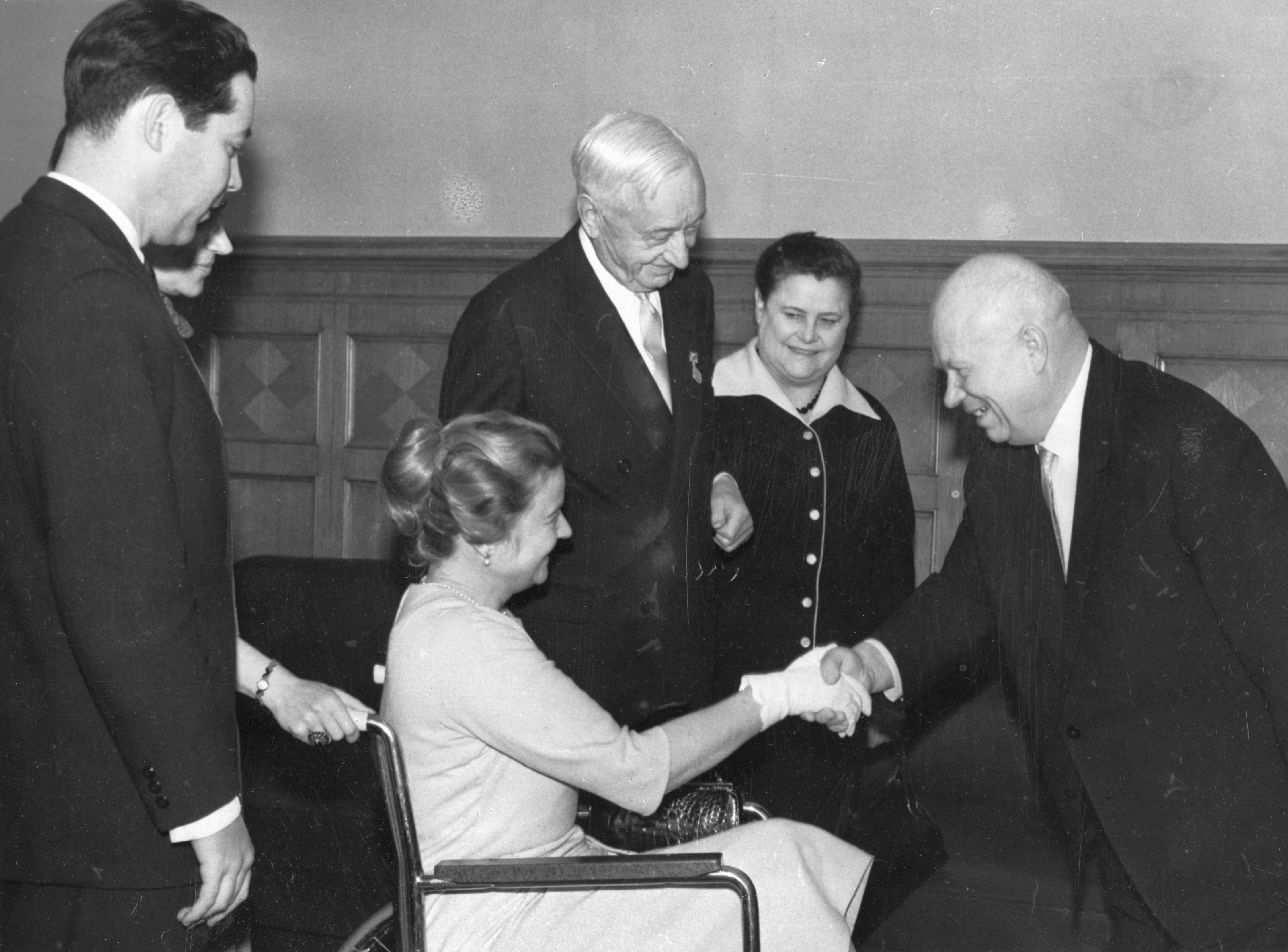 Cyrus Eaton (standing) and his wife Anne (seated in a wheelchair) meet with Nikita Khrushchev in Moscow, 1964.  