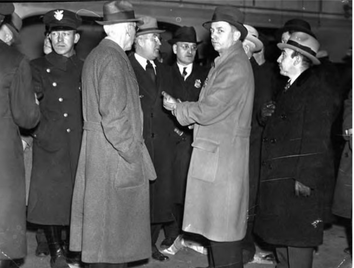 13 January 1936 police raid of the Harvard Club, led by Safety Director Eliot Ness. Left to right in civilian dress: Det. Sergt. Patrick Ryan, Prosecutor Cullitan, Al Cumat, Eliot Ness, Frank Celebrezze