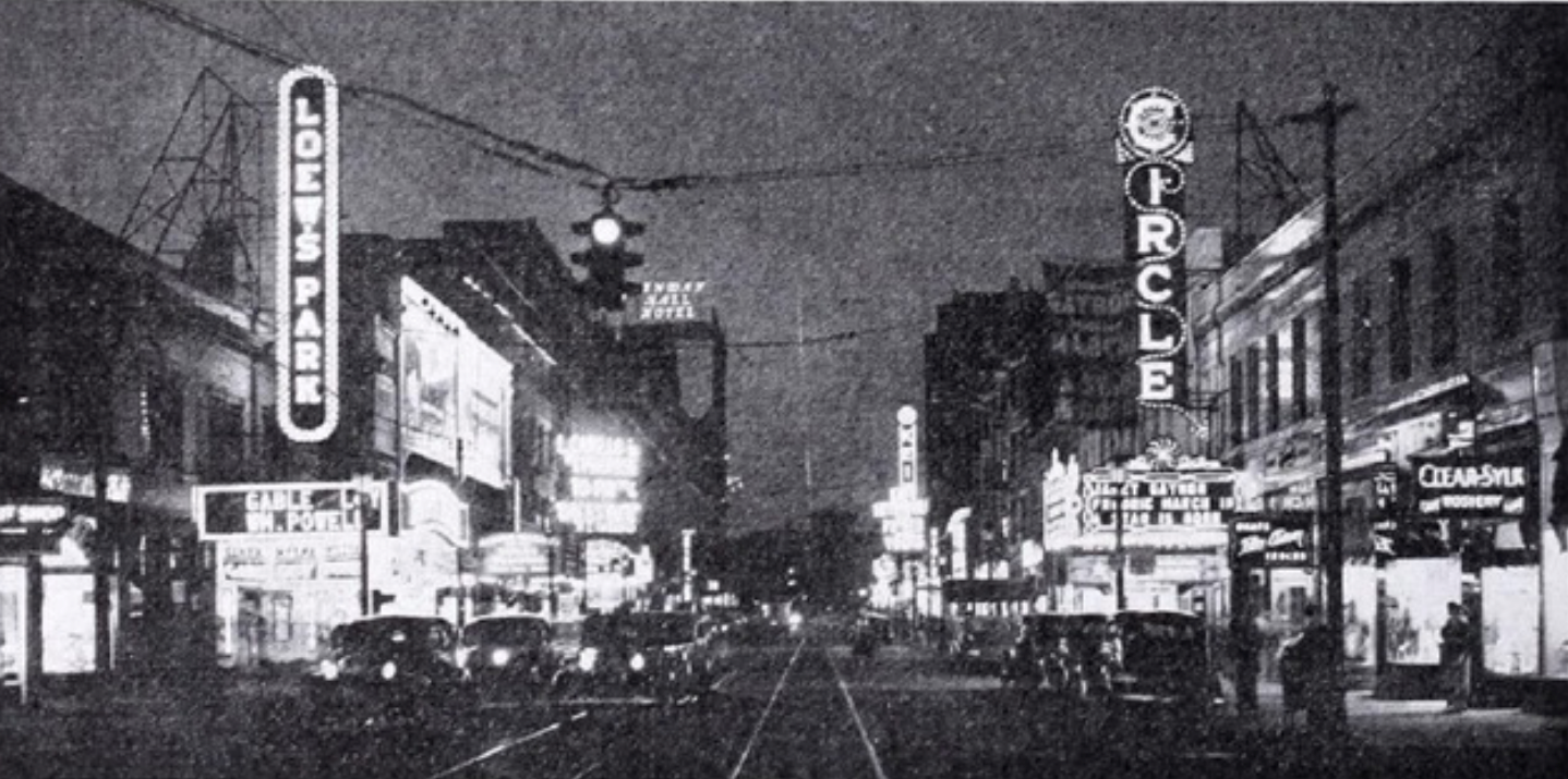 Street view showing theaters and buildings along Euclid Avenue