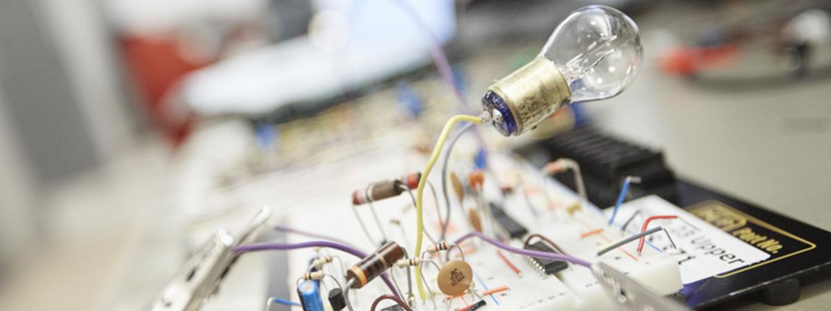 Tools, wires, and light bulb