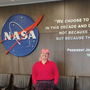 Jackson Smith in front of NASA sign