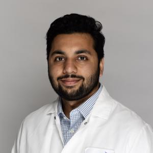 Muhammad Haroon in lab coat