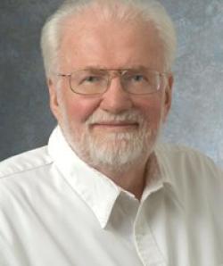 Headshot of J Mann