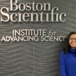 Saloni Baral in front of Boston Scientific sign