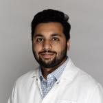 Muhammad Haroon in lab coat