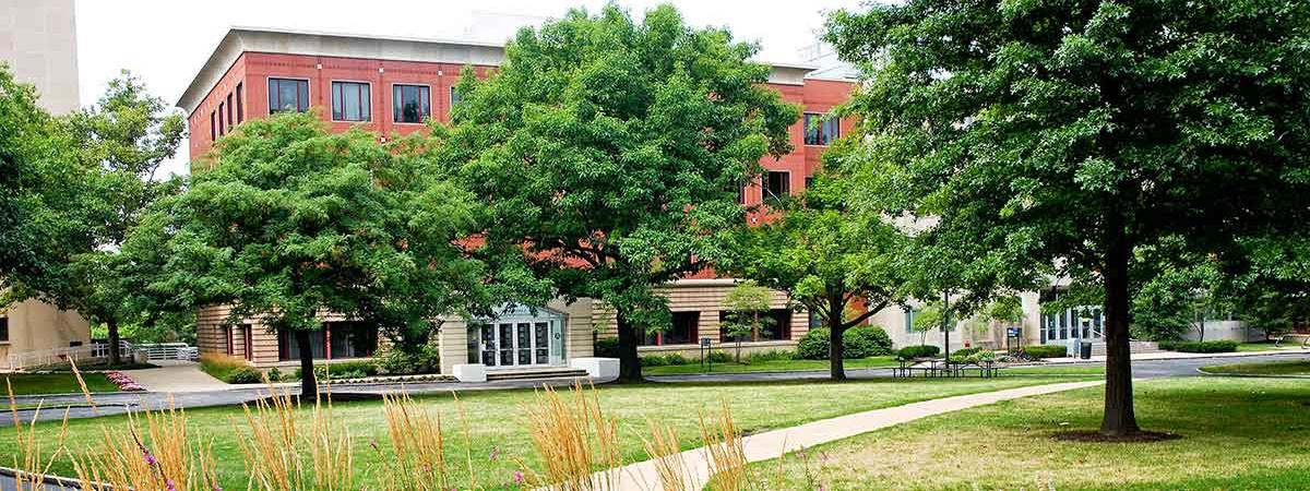 Exterior shot of academic building surrounded by trees