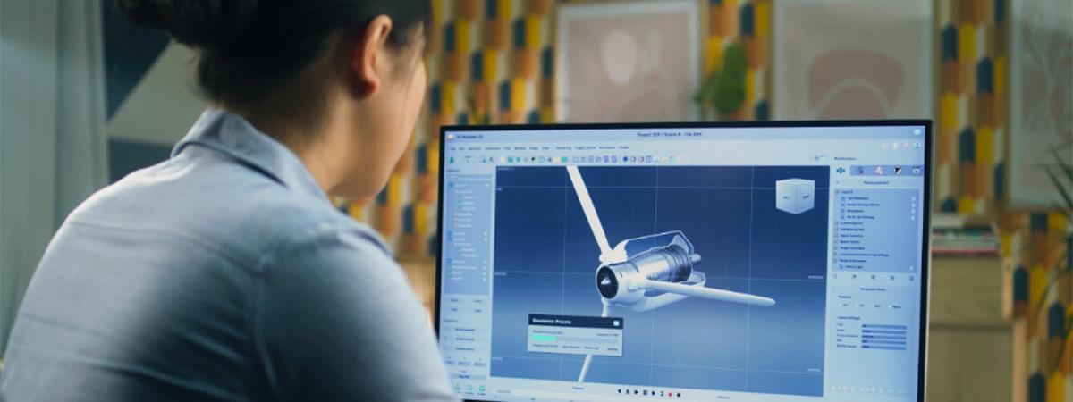 student sitting looking at a computer screen