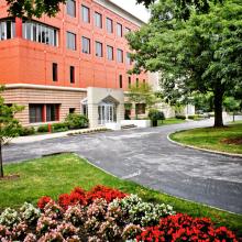 exterior of building with flowers and a walkway