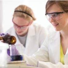 Macromolecular Science and Engineering students working in a lab