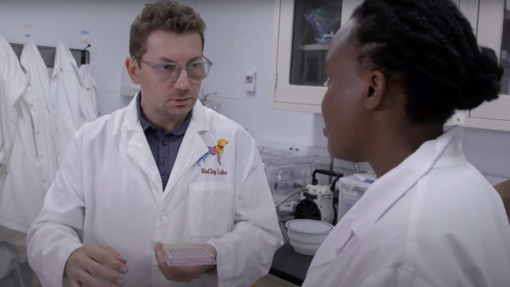 Umut Gurkan in the lab with a student