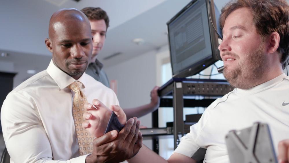 Bolu Ajiboye working with a patient