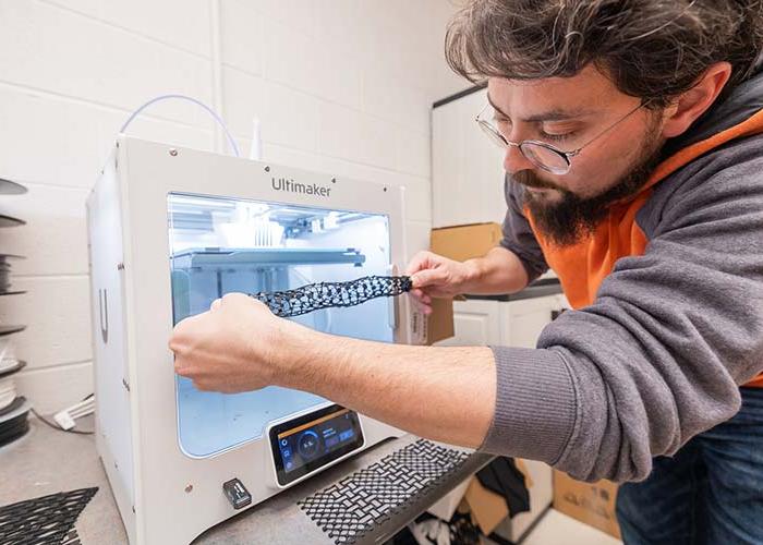 Researcher placing object into container