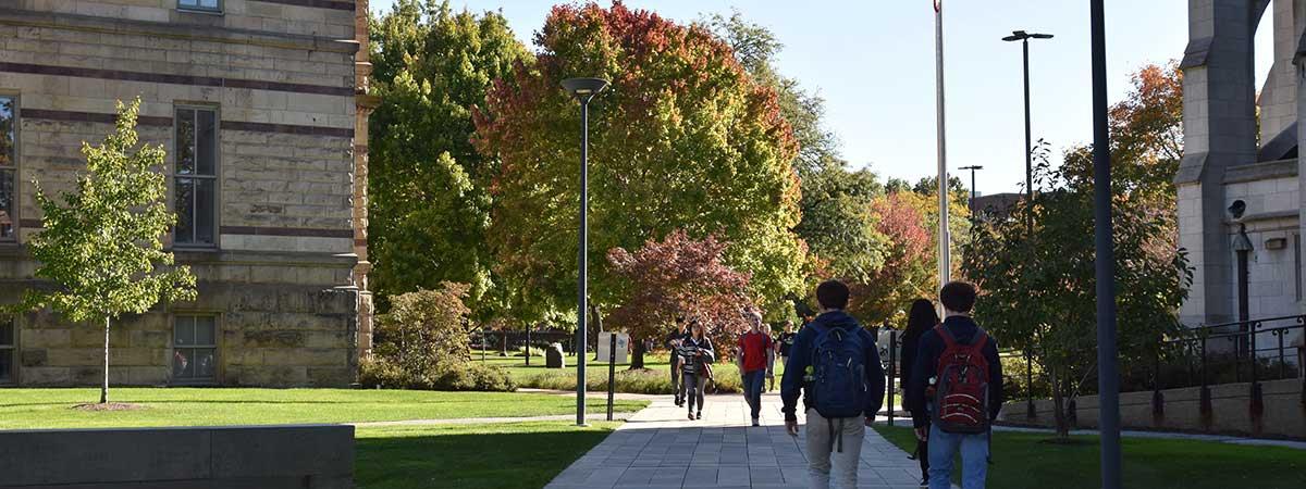 Students walking on binary-walkway