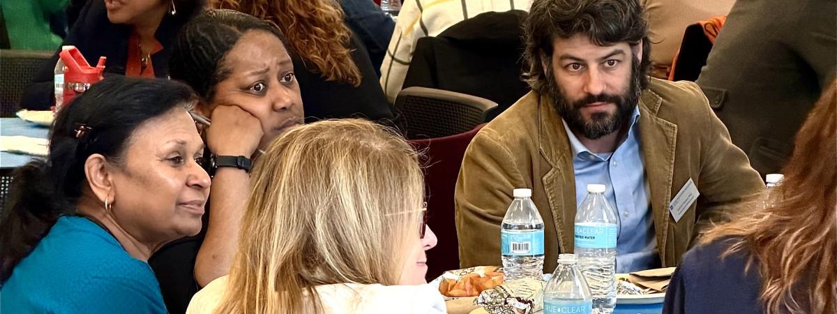 People sitting at table talking