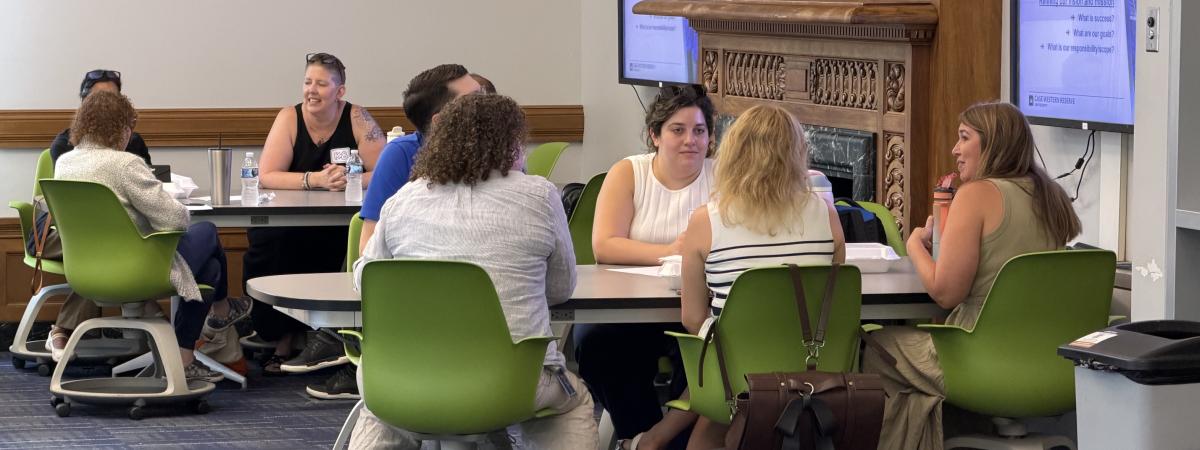 People sitting at tables having conversations