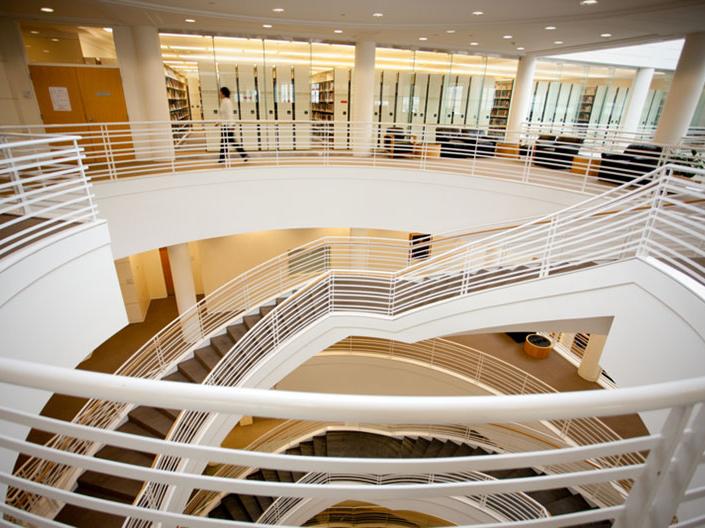 View of a staircase with a person walking in the distance