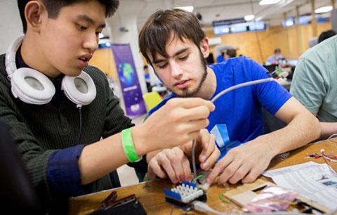 Two male students working on a project together