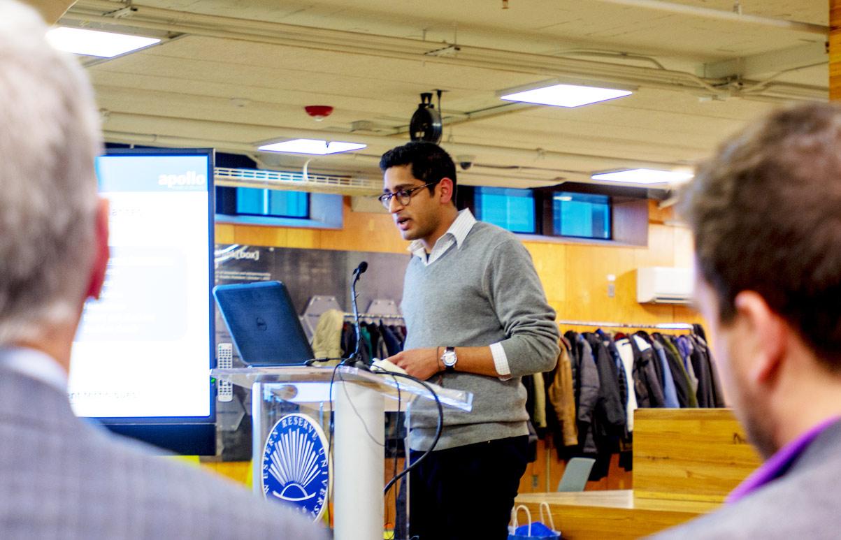 Student entrepreneur at Case Western Reserve University standing at a podium pitching his idea.