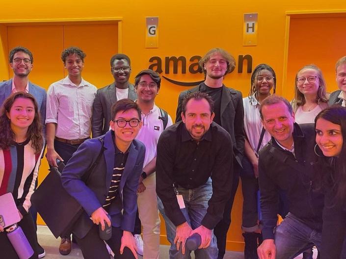 VEAL333 students pose in front of Amazon logo