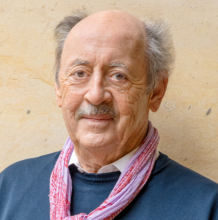 Billy Collins in sweater and scarf around his neck