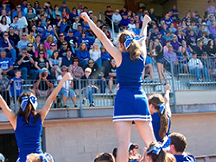 Case Western Reserve University cheerleaders cheering at a football game