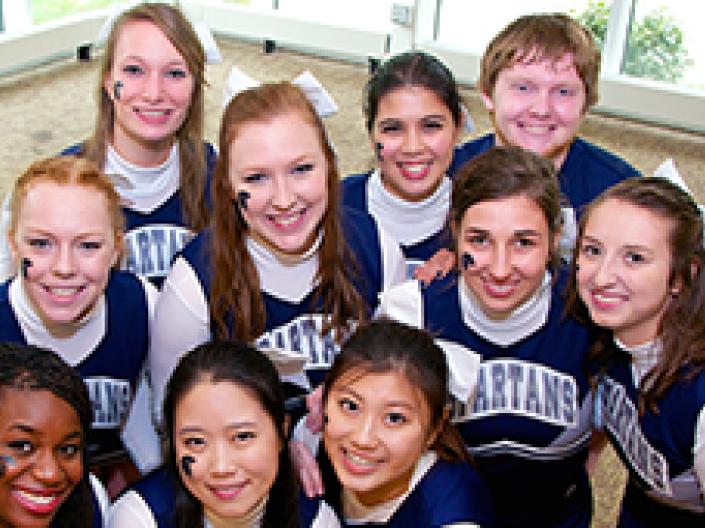 A group of smiling Case Western Reserve University cheerleaders