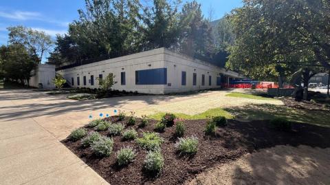 Picture of the exterior of the Dental Research Building with landscaping