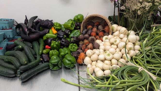 A selection of fresh produce is arranged on a counter