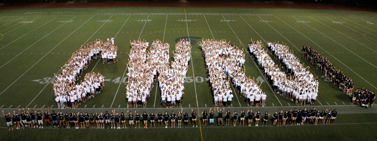 students spell out CWRU on the football field