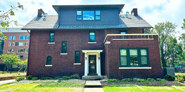 The front view of a large brick house