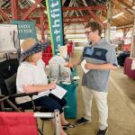 At a recent county fair, CWRU’s Fred Schumacher talked with a potential participant about the study he leads in the wake of the train derailment in East Palestine, Ohio, to monitor the health of area residents potentially exposed to hazardous chemicals.