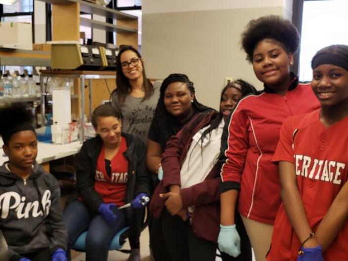 Group of kids standing in a research lab