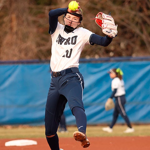 Lexi Miskey pitching a softball