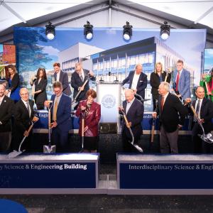 CWRU leaders take part in a ceremonial groundbreaking for the ISEB while wearing formal attire