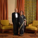 Dr. Krishan and Sneh Chandar pose for camera wearing formal attire
