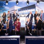 Members of CWRU Community use shovels to participate in ceremonial groundbreaking event for ISEB construction