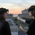 People with virtual reality headsets looking at an ancient city