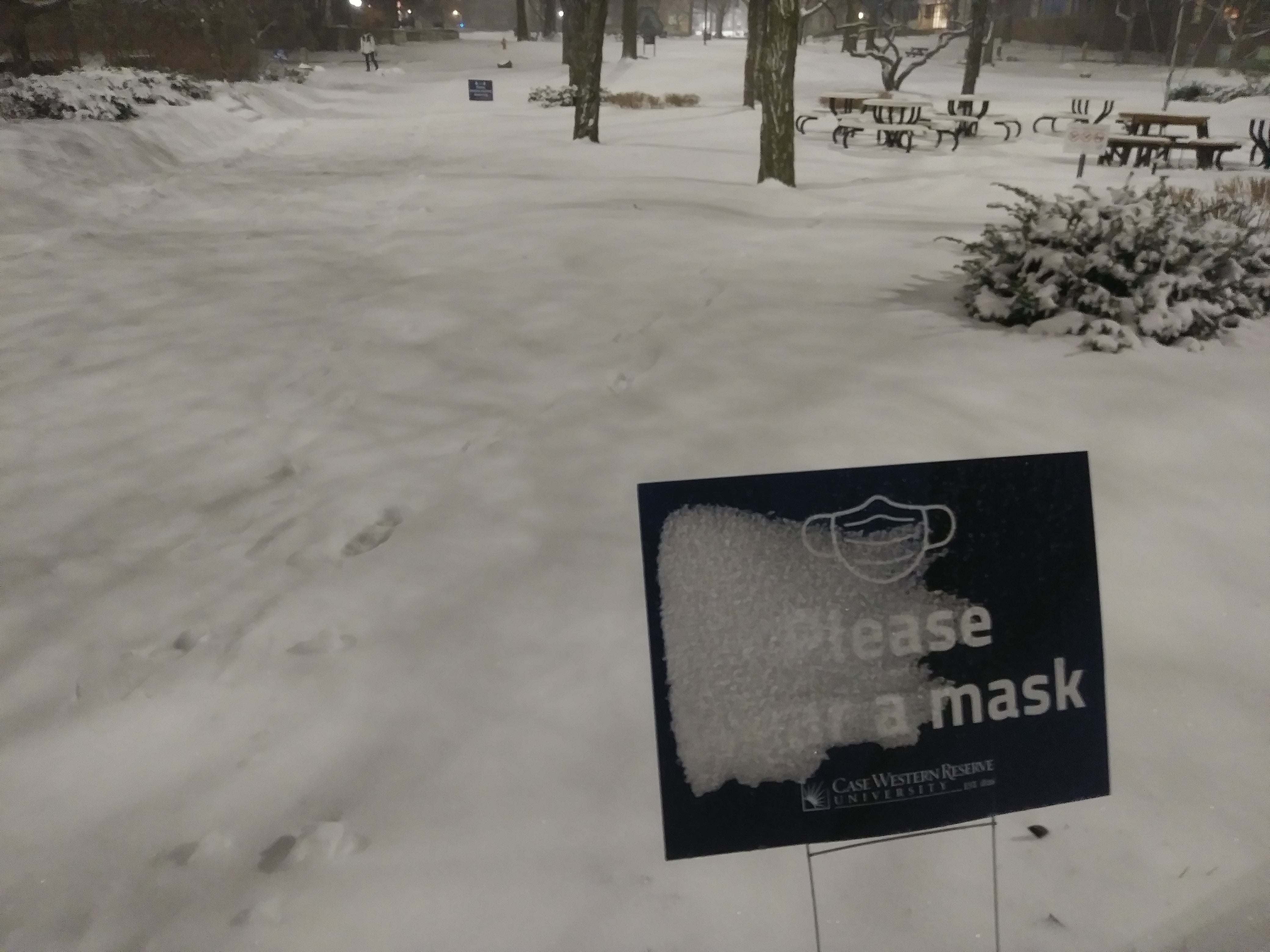 "Please Wear a Mask" sign on Main Quad near Rockefeller in a Snow Storm, February 2021