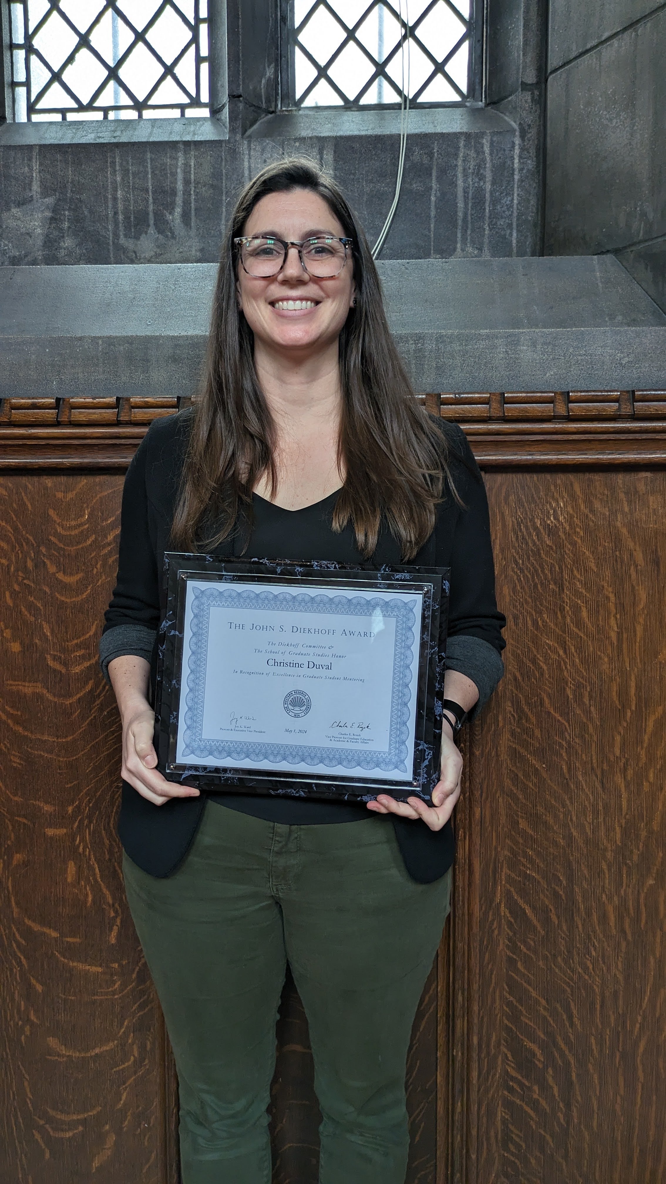 Christine Duval holding Diekhoff plaque