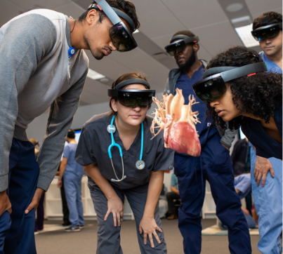 students wearing hololens looking at heart