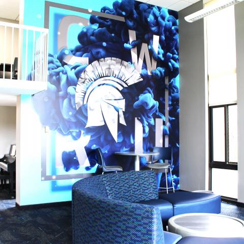 Clarke Tower Lounge with CWRU Mural and surrounding furniture