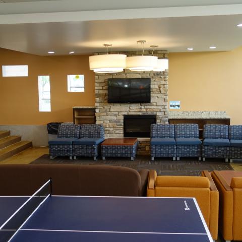 Taplin House Common Room showing furniture, television, and game tables