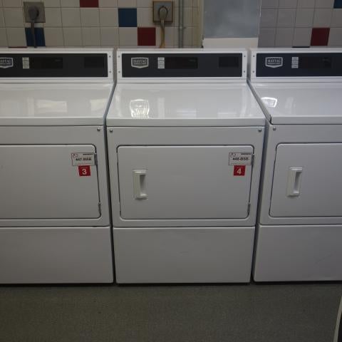 Tyler House Laundry Room with washing and drying machines