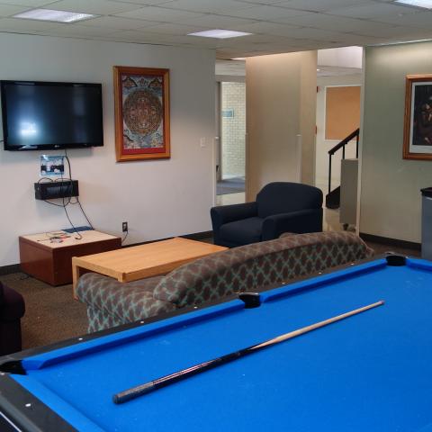 Cutler House Common Room with pool table, furniture, and television
