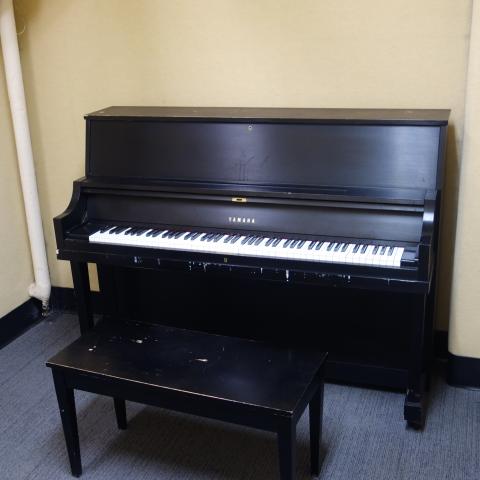 Kusch House Basement Practice Room showing common piano and bench